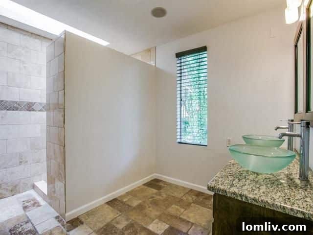 Elegant fixtures and spacious layout of the fifth-level master bathroom