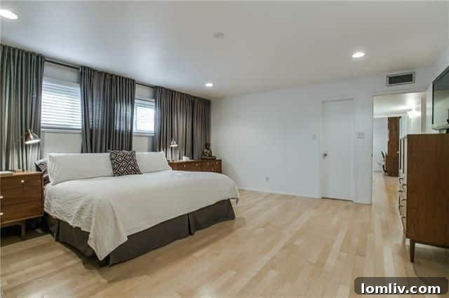 Another comfortable secondary bedroom, perfect for family or guests, featuring hardwoods and ample space