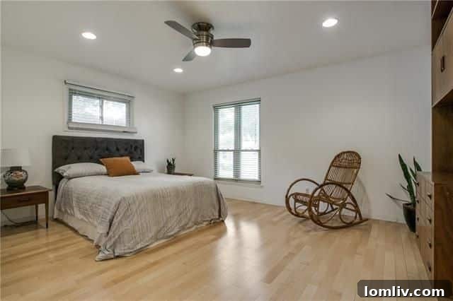 Expansive backyard with a large poured patio, ideal for outdoor entertainment and relaxation