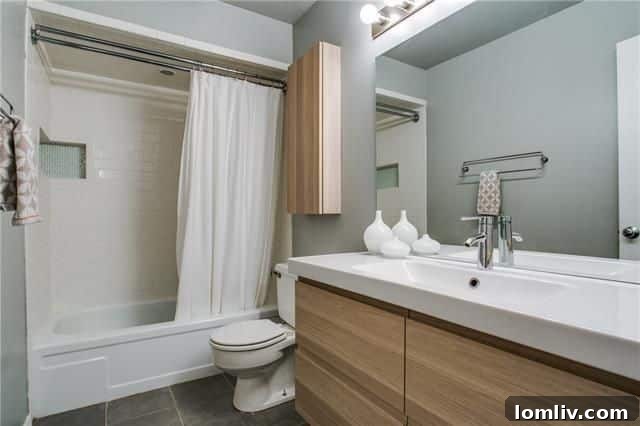 Secure backyard featuring a newer fence and mature live oak trees providing natural shade
