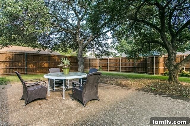 View of the large backyard, highlighting the privacy and space offered by the property