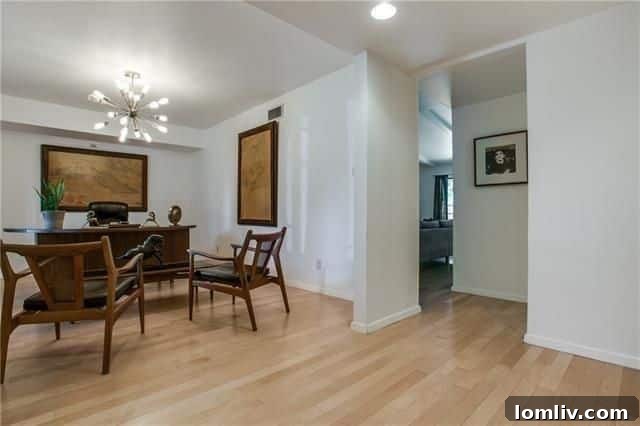Inviting living room with vaulted ceilings and a floor-to-ceiling brick fireplace, showcasing modern interiors