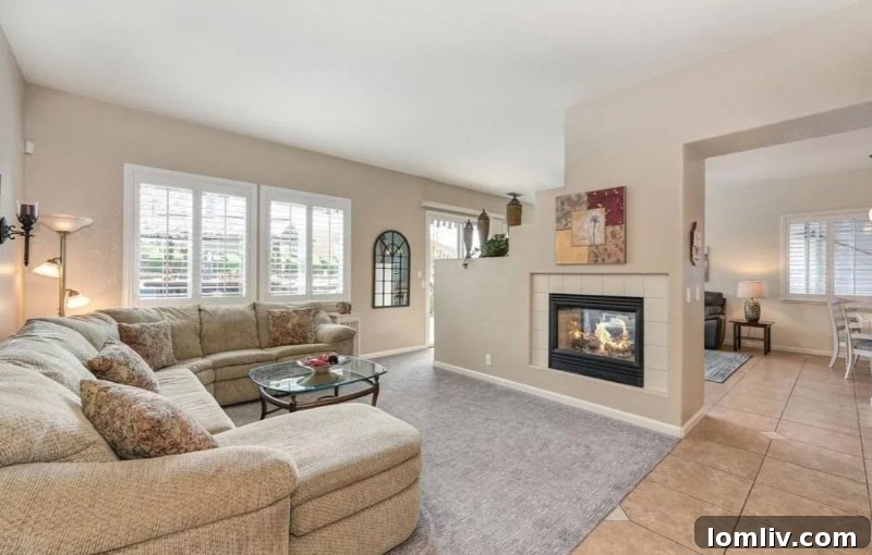 California's Parrothead Paradise: Your Margaritaville Escape 5 Elegant living room interior with neutral beige walls, plush rug, and ample natural light in Folsom, CA home.