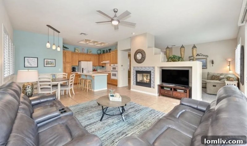California's Parrothead Paradise: Your Margaritaville Escape 6 Stylish dining area flowing into an open-concept kitchen, featuring modern lighting and natural wood accents in Folsom, CA.