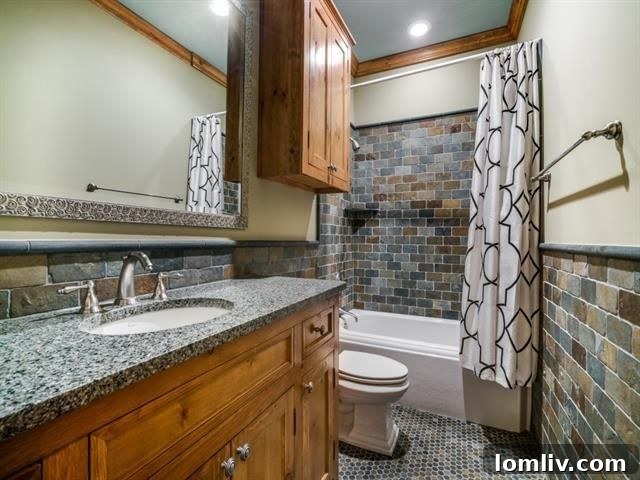 Well-appointed full bathroom with elegant fixtures and finishes