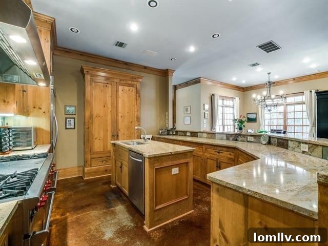 Gourmet kitchen with high-end appliances, knotty pine cabinets, and elegant countertops in 5726 Vickery Blvd