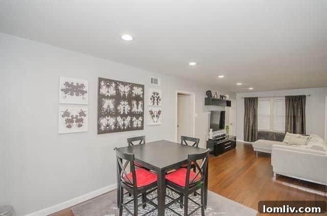 Modernized Lochwood Cottage Harmonizes Contemporary Style and Classic Appeal 6 Updated dining area flowing into kitchen at 11379 Lanewood Cir