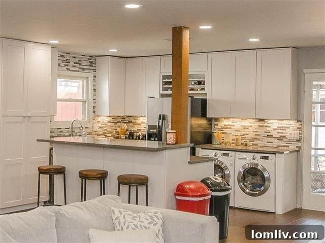 Modern kitchen with custom white cabinets at 11379 Lanewood Cir