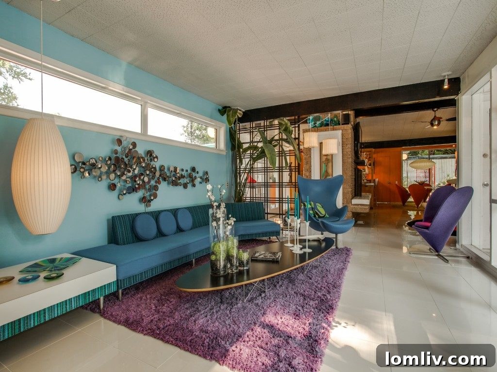 A tastefully decorated guest bedroom featuring authentic Midcentury Modern furniture and welcoming ambiance