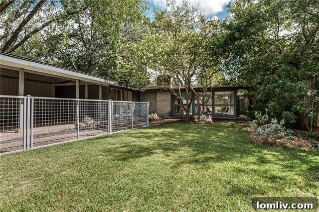 A beautifully preserved Mid-Century Modern home exterior with a classic low-slung roofline and expansive windows