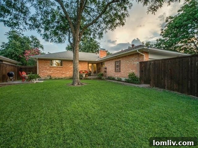 Charming backyard patio with mature trees in East Dallas home