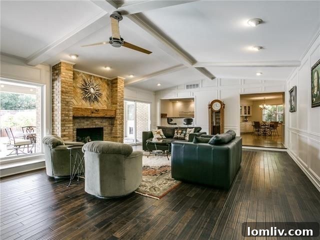 Bright great room with wall of windows overlooking the pool