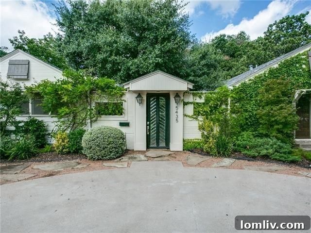 Charming exterior of 5435 Westside Dr, featuring mature landscaping