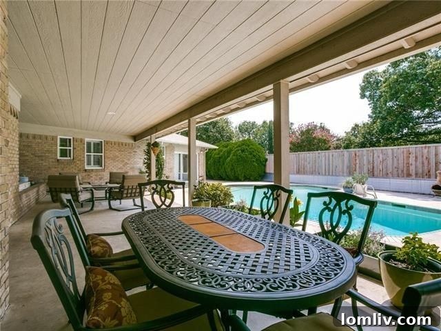 Inviting swimming pool and covered patio for outdoor entertaining