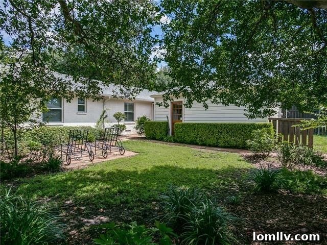 Private backyard with lush greenery at 5435 Westside Dr