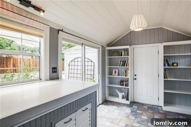 Overview of the charming Elmwood cottage from the side yard