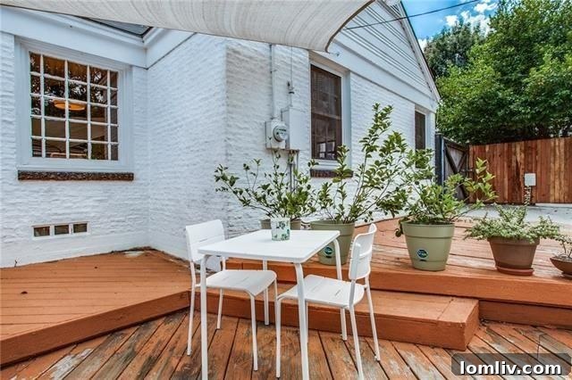 Inviting front porch of 1611 Cascade Ave with space for seating