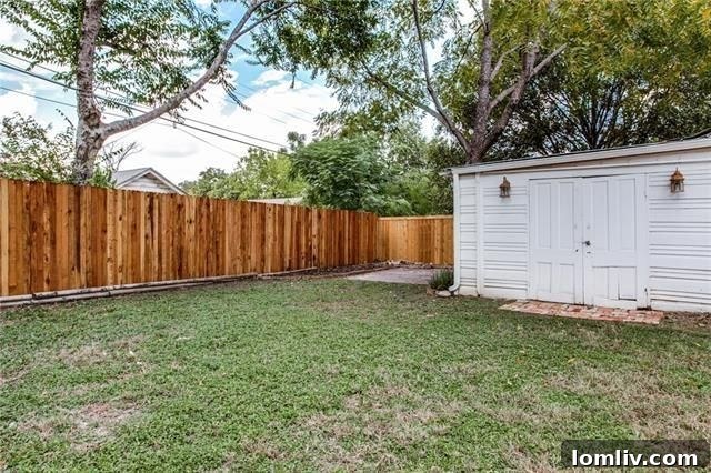 Another angle of the backyard deck and lush green lawn