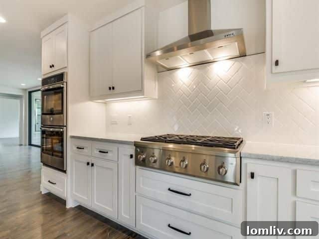 Gourmet kitchen with Carrara Marble counters and walnut shelves