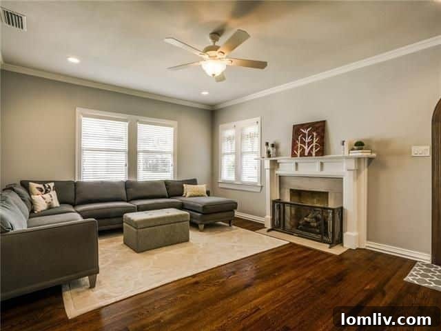 Bright and welcoming living area with original fireplace