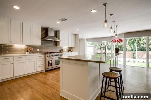 Modern gourmet kitchen with Dacor appliances and quartz counters