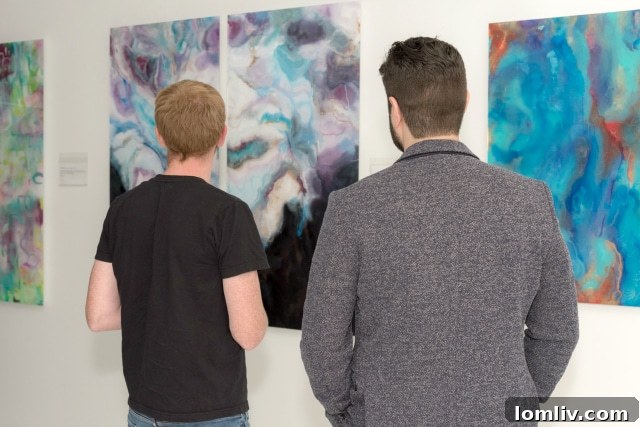 Jennifer Ayyad and Ricardo Salas Jr. discussing their artworks at the exhibition