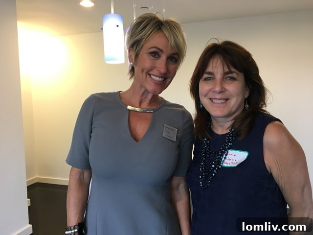 Valerie Jarvie, daltxrealestate.com writer, posing with Kelly Nyfeler, Briggs Freeman Uptown Director of Sales, at The Warrington event, reflecting the professional and social networking.