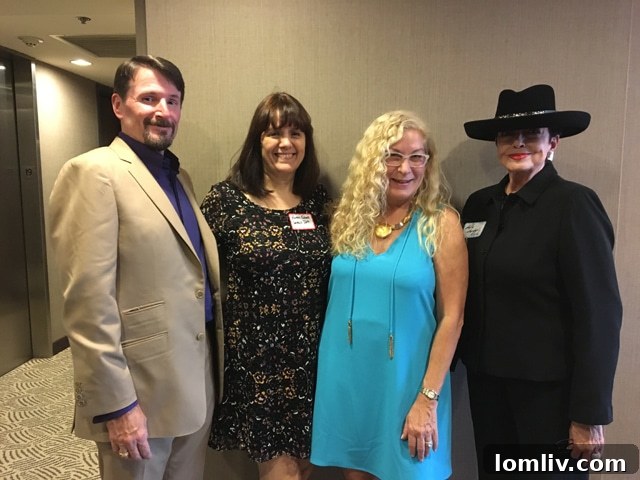 Candy, the host, and her team, along with Ebby agent and Champions professional Kellie Logsdon Rush, smiling at The Warrington event, capturing the vibrant atmosphere.