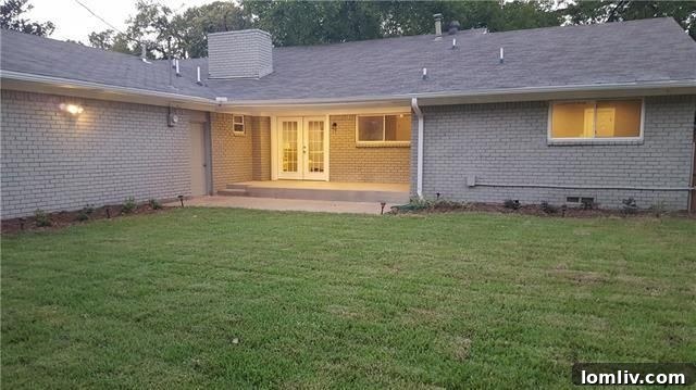 Green Lawn and Mature Trees in the Backyard