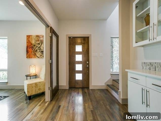 Elegant Entryway with Hardwood Floors and French Doors