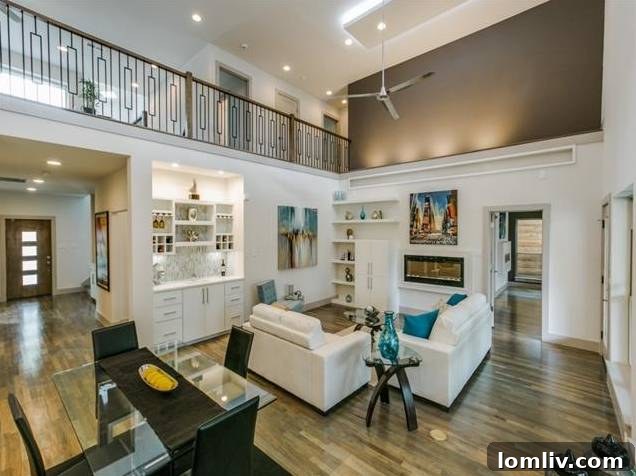 Spacious Two-Story Living Area with Modern Fireplace