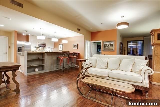 Elegant dining area with wide-plank flooring and natural light