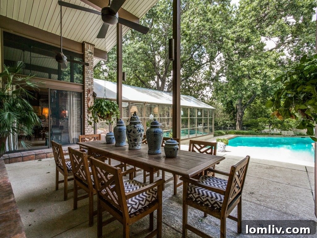 The sparkling 12-foot-deep swimming pool, inviting relaxation and recreation.