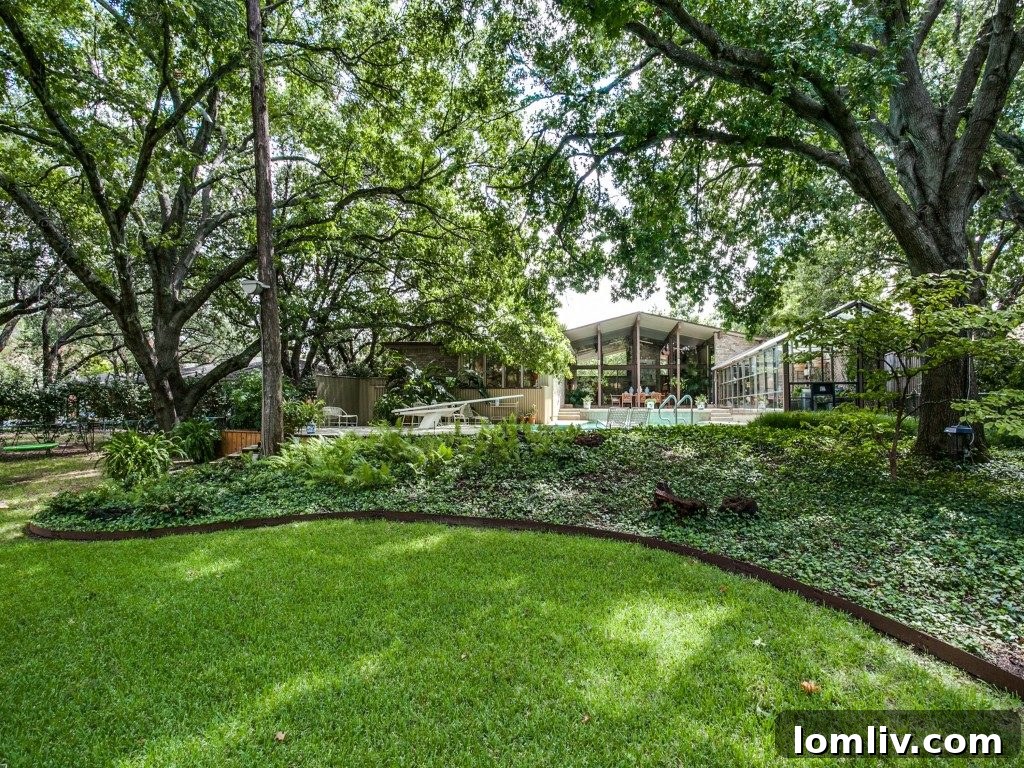 Expansive outdoor patio and entertaining space, overlooking the pool and lake.