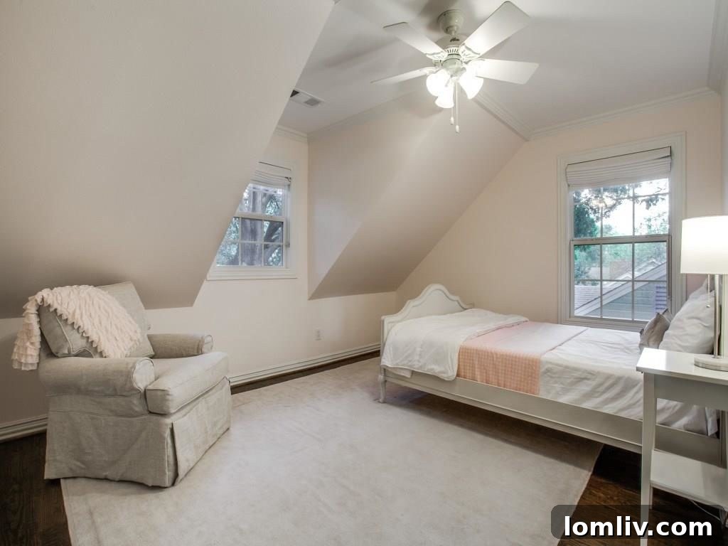 Peninsula Perfection: Adorable Southern Traditional, Steps to White Rock Lake 15 Spacious guest bedroom with ample natural light