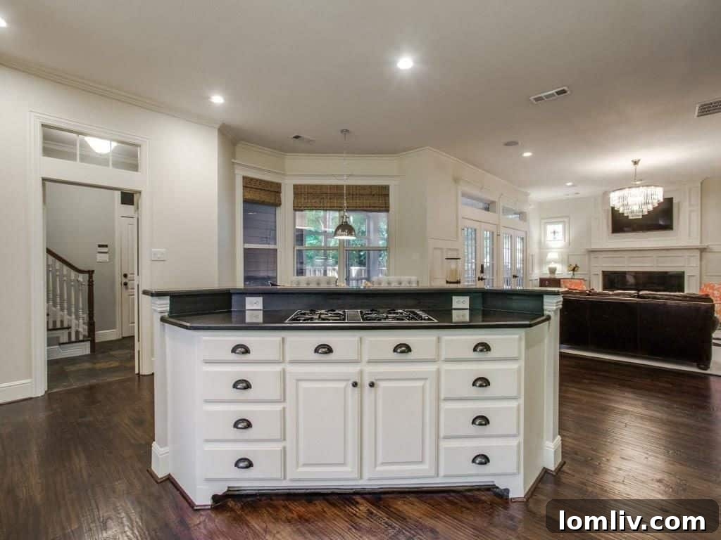 Peninsula Perfection: Adorable Southern Traditional, Steps to White Rock Lake 9 Serene master bedroom with a fireplace and elegant decor