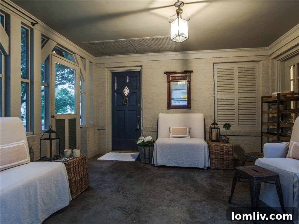 Cozy seating area within the screened front porch of the cottage