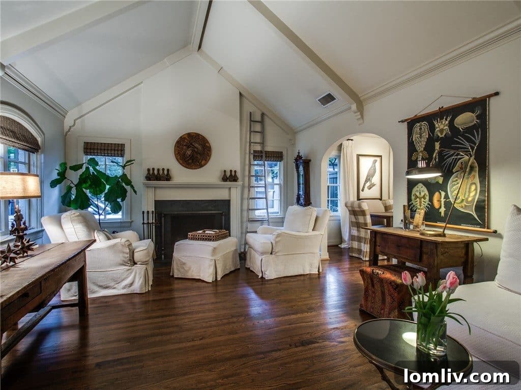 Spacious living room with vaulted ceilings and rich oak wood flooring