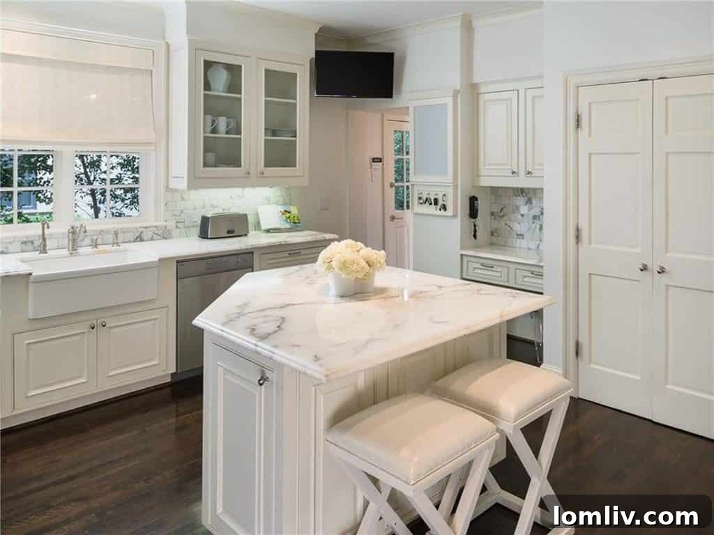 Luxurious updated kitchen with marble countertops and Wolf & Sub Zero appliances