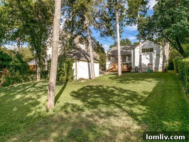 Lush, spacious backyard with an elevated wood deck and mature landscaping