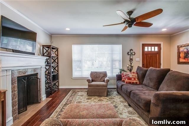 Cozy living room with a classic fireplace and lustrous hardwood floors