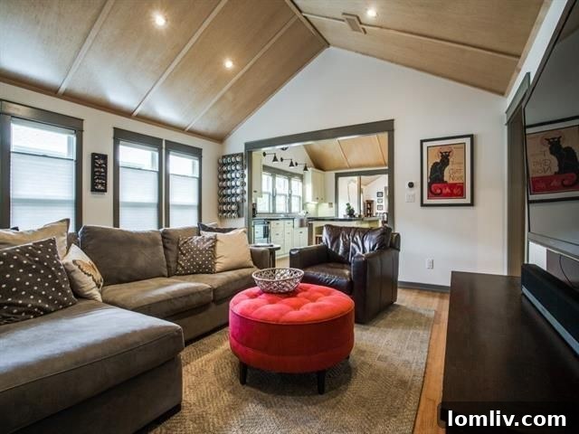 Gourmet kitchen with sage green cabinets, granite counters, and high-end appliances in the renovated Craftsman