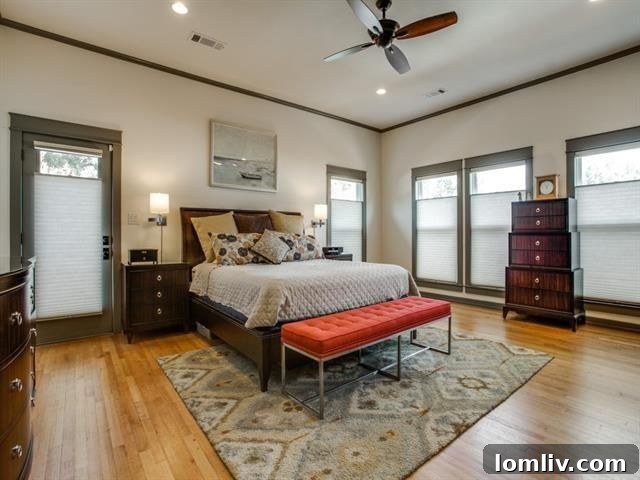 Spacious master bedroom with elegant built-in desk and bookshelves