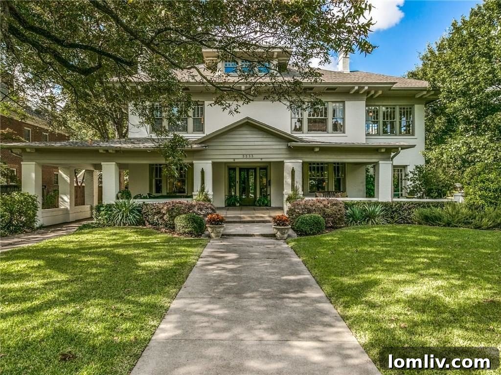 Stunning exterior of Mary Mapes' historic Swiss Avenue home in Dallas, a classic Foursquare prairie architectural style.