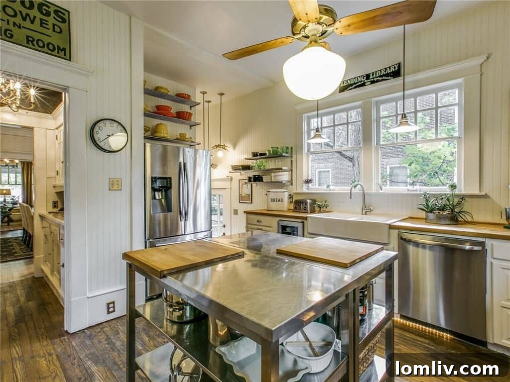 Detail view of the updated kitchen with high-end appliances, custom cabinetry, and a functional island.