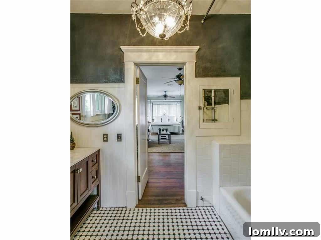Luxurious master bathroom with modern fixtures, dual vanities, and a spacious shower area.