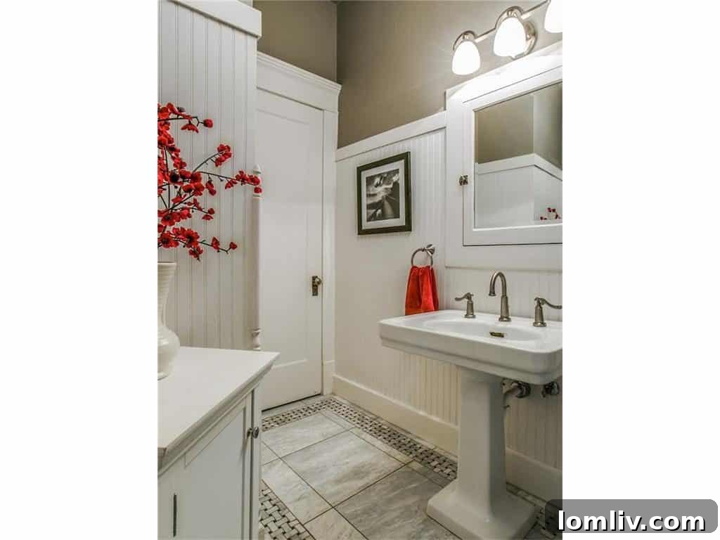 Well-appointed guest bathroom, featuring classic tilework and contemporary fixtures.