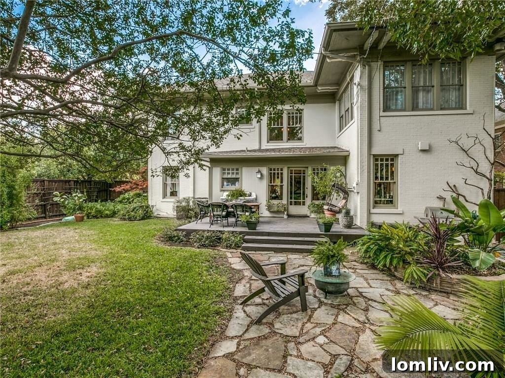 Expansive rear yard of the property, offering privacy, lush landscaping, and ample green space for outdoor activities.