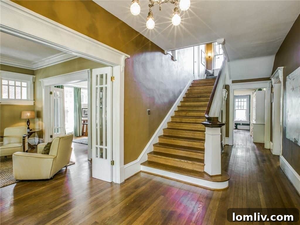 Classic wooden staircase leading to the upper floor, featuring traditional banisters and newel posts.