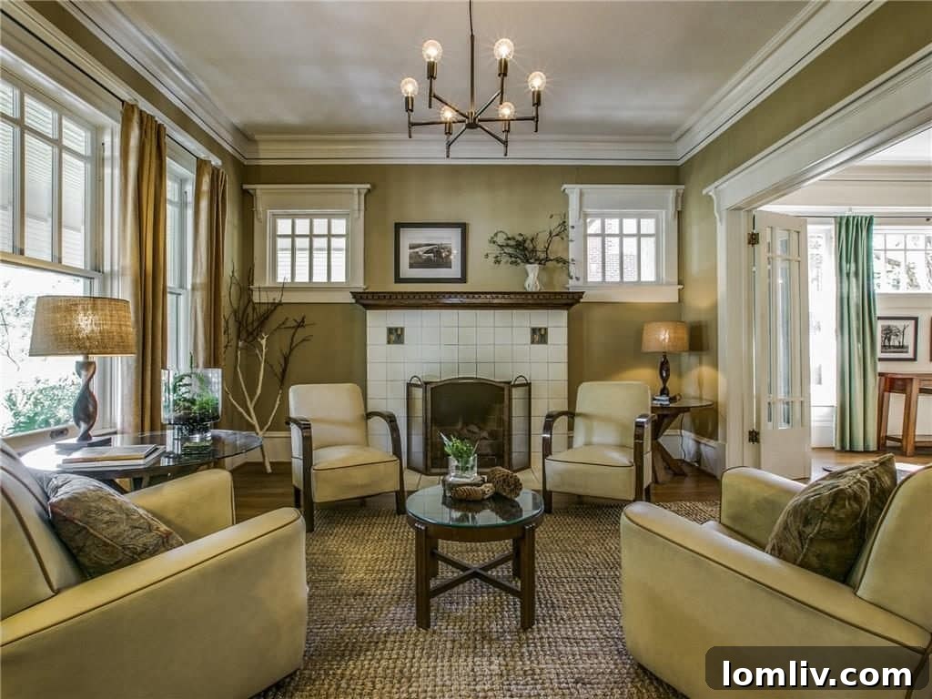Spacious living room featuring one of the historic Rookwood fireplaces, with ample natural light and period-appropriate decor.